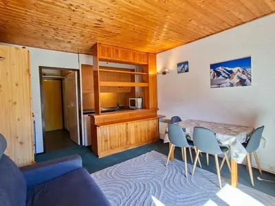 a living room with a dining room table and chairs at Studio confortable à Flaine, balcon et proximité pistes - FR-1-425-180 in Flaine