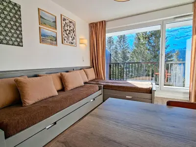 a living room with a couch and a large window at Appartement Confortable 4 Pers. Flaine Centre, Balcon Sud - FR-1-425-161 in Flaine