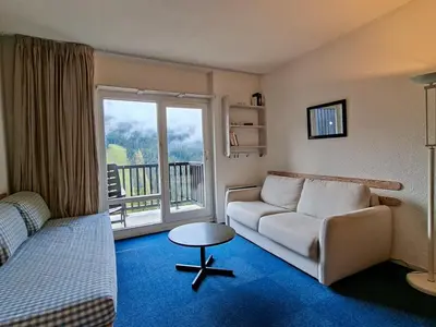 a living room with a couch and a window at Studio lumineux 4 pers avec balcon, Flaine - FR-1-425-163 in Flaine