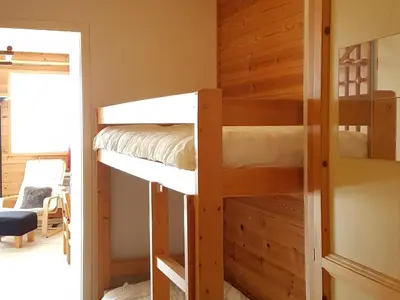 a bunk room with two bunk beds and a doorway at Studio lumineux avec balcon - Flaine - FR-1-425-160 in Flaine