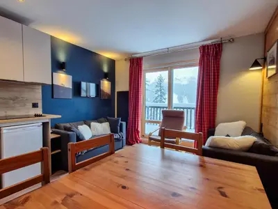 a living room with a couch and a table at Appartement Sud Confort 4-5 pers, Balcon, Proche pistes - FR-1-425-173 in Flaine