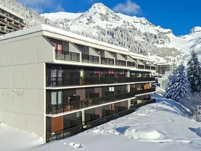 a building in the snow with a mountain at Appartement Sud Confort 4-5 pers, Balcon, Proche pistes - FR-1-425-173 in Flaine