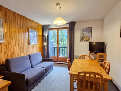 a living room with a couch and a table at Studio cabine confortable à Flaine, balcon sud, proche pistes - FR-1-425-171 in Flaine