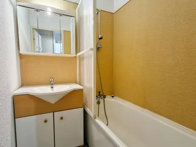 a bathroom with a sink and a mirror and a tub at Studio cabine confortable à Flaine, balcon sud, proche pistes - FR-1-425-171 in Flaine