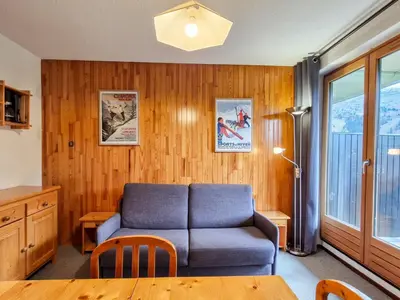 a living room with a couch and a table at Studio cabine confortable à Flaine, balcon sud, proche pistes - FR-1-425-171 in Flaine
