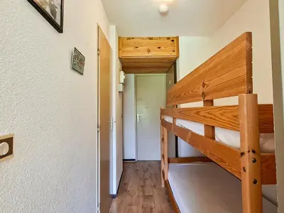 a bedroom with two bunk beds in a house at Studio confortable avec balcon au centre de Flaine - FR-1-425-174 in Flaine