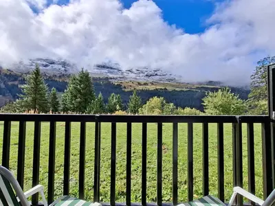 a balcony with chairs and a view of the mountains at Studio confortable avec balcon au centre de Flaine - FR-1-425-174 in Flaine