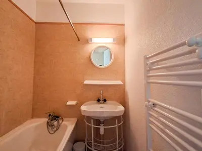 a bathroom with a sink and a tub and a mirror at Studio confortable avec balcon au centre de Flaine - FR-1-425-174 in Flaine