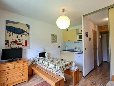 a small room with a bed and a kitchen at Studio confortable avec balcon au centre de Flaine - FR-1-425-174 in Flaine