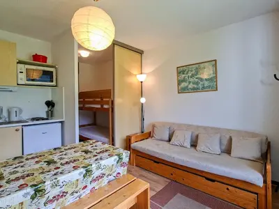 a room with a bed and a couch in it at Studio confortable avec balcon au centre de Flaine - FR-1-425-174 in Flaine