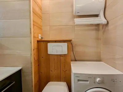 a small bathroom with a toilet and a washing machine at Studio rénové à Flaine - 4 pers. proche des pistes - FR-1-425-178 in Flaine