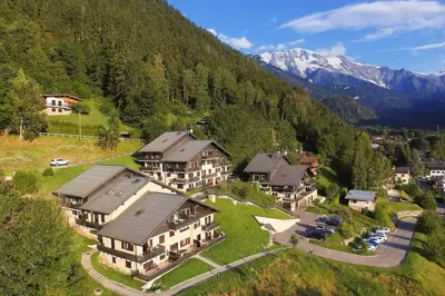 an aerial view of a house in a mountain at Appartement dans châlet avec piscine couverte in Saint-Gervais-les-Bains