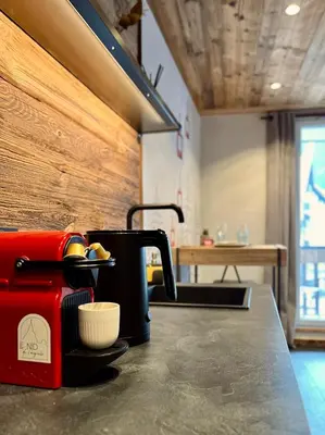 a coffee maker sitting on top of a counter at Le Nid de l'Aiguille - Au pied de l'Aiguille du midi in Chamonix-Mont-Blanc
