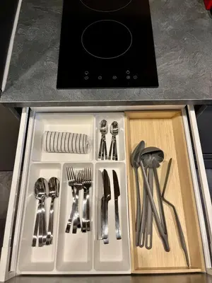 a drawer with knives and utensils in a kitchen at Le Nid de l'Aiguille - Au pied de l'Aiguille du midi in Chamonix-Mont-Blanc