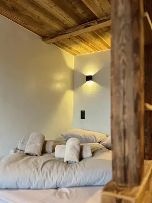 a bedroom with two beds with pillows on them at Le Nid de l'Aiguille - Au pied de l'Aiguille du midi in Chamonix-Mont-Blanc