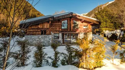 a bathroom with a tub and a sink and a toilet at Chalet Entre Nous in Chamonix-Mont-Blanc