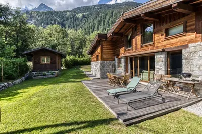 a kitchen with a stove and a sink in a room at Chalet Entre Nous in Chamonix-Mont-Blanc