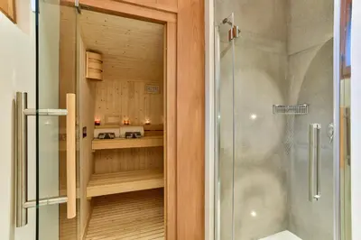a bathroom with a shower and a glass door at Chalet du Bois in Chamonix-Mont-Blanc