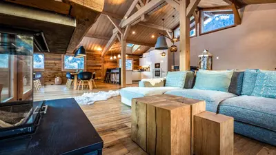 a living room with a couch and a table at Chalet du Bois in Chamonix-Mont-Blanc