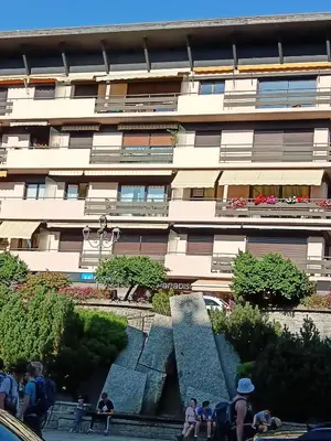 people standing in front of a building with a fountain at LE PARADISO centre SAINT-GERVAIS in Saint-Gervais-les-Bains