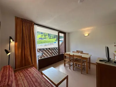 a room with a bed and a table and a window at Appartement 1 Chambre, Coin Montagne, Vue Pistes, 4 Pers - FR-1-642-64 in Morillon