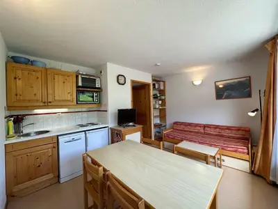 a bedroom with a bed and wooden cabinets at Appartement 1 Chambre, Coin Montagne, Vue Pistes, 4 Pers - FR-1-642-64 in Morillon
