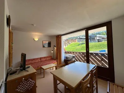 a living room with a table and a large window at Appartement 1 Chambre, Coin Montagne, Vue Pistes, 4 Pers - FR-1-642-64 in Morillon