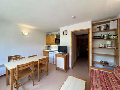 a kitchen and dining room with a table and chairs at Appartement 1 Chambre, Coin Montagne, Vue Pistes, 4 Pers - FR-1-642-64 in Morillon