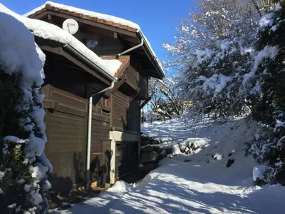 a house with snow on the side of it at Chalet Le Paddock in Saint-Gervais-les-Bains