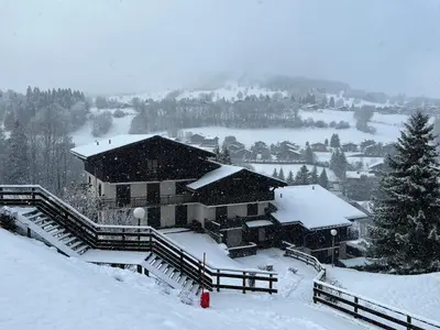 a snow covered building on a hill with snow at Le Sapin B19 Megeve - Demi Quartier in Megève