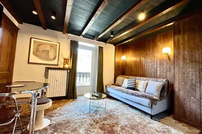 a living room with a couch and a table at Tatiana 2 in Megève