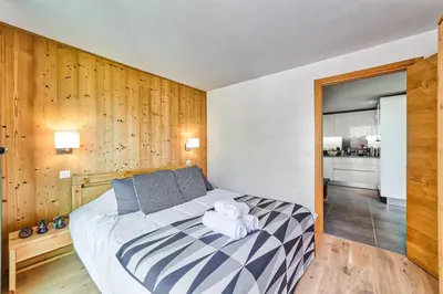 a bedroom with a bed with a towel on it at California in Chamonix-Mont-Blanc