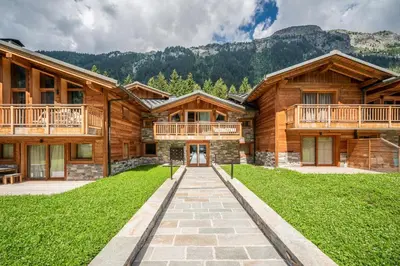 a log home with a walkway in front of it at Apartment Celosia Chamonix - by EMERALD STAY in Chamonix-Mont-Blanc