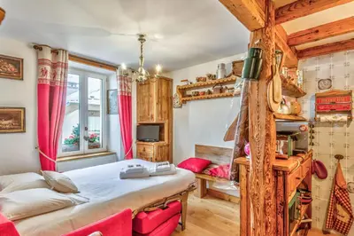 a bedroom with a large bed in a room at Appartement de l'Alpage - Welkeys in Megève