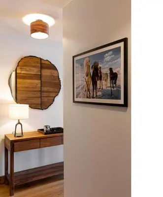 a room with a desk and a picture on the wall at Apache_Coudriers in Megève
