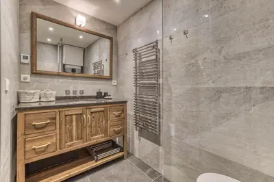 a bathroom with a sink and a mirror at Chalet 3 étoiles pour 4 pers avec vue imprenable sur la vallée de Chamonix in Les Houches