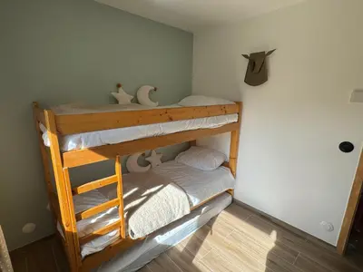 a bunk bed room with two bunk beds at Marmots Clan Megève in Megève