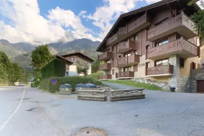 a building on the side of a street next to a road at Le Grand Tetras - Beside Lake Chavants, TMB staring point & Hikes in Les Houches
