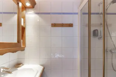 a bathroom with a sink and a shower at Le Grand Tetras - Beside Lake Chavants, TMB staring point & Hikes in Les Houches