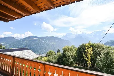 a balcony with a view of mountains and trees at Nice Peaceful Cottage With Garden And Balcony in Saint-Gervais-les-Bains