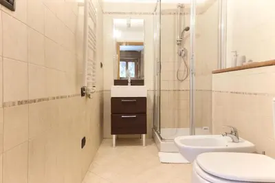 a bathroom with a shower and a sink and a toilet at Les Granges des Bossons in Chamonix-Mont-Blanc