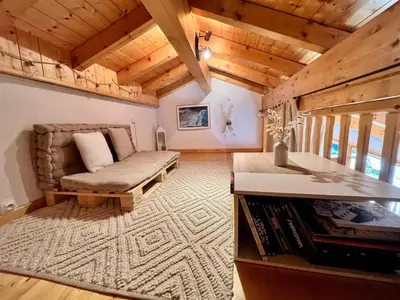 a living room with a couch and a table at Appartement chaleureux avec balcon près du centre - FR-1-624-112 in Samoëns
