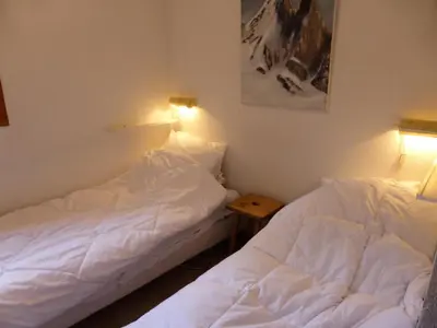 two beds sitting next to each other in a room at Résidence Palmes D'or - Palmes d'Or B109 MAE-5504 in Les Contamines-Montjoie