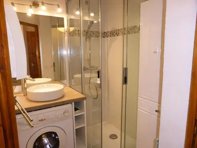 a bathroom with a sink and a glass shower at Résidence Palmes D'or - Palmes d'Or B109 MAE-5504 in Les Contamines-Montjoie