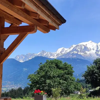 a view of snow covered mountains from a cabin at Chalet récent vue panoramique sur le MONT-BLANC in Combloux