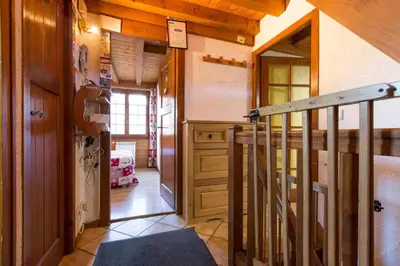 a hallway of a house with a staircase and a room at Chalet spacieux à Saint-Gervais-les-Bains avec vue montagne in Saint-Gervais-les-Bains