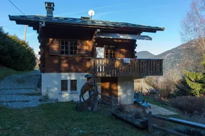 a log cabin with a porch and a balcony at Chalet spacieux à Saint-Gervais-les-Bains avec vue montagne in Saint-Gervais-les-Bains