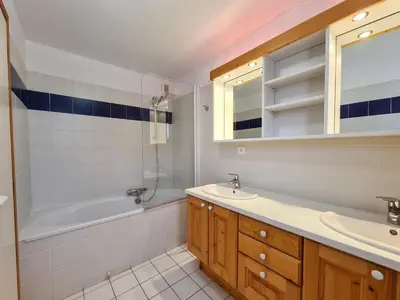 a bathroom with a tub and a sink and a shower at Chalet lumineux · Sauna privatif · Garage · 12 personnes - FR-1-425-119 in Arâches-la-Frasse