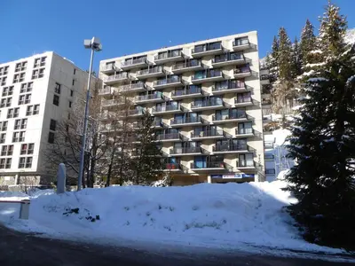 a tall building with snow in front of it at Studio lumineux proche des pistes avec balcon - FR-1-425-169 in Arâches-la-Frasse