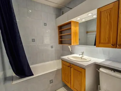 a bathroom with a sink and a bath tub at Studio lumineux proche des pistes avec balcon - FR-1-425-169 in Arâches-la-Frasse